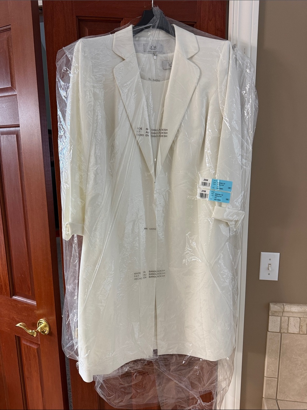 Women’s Le Suit dress and long cream coat